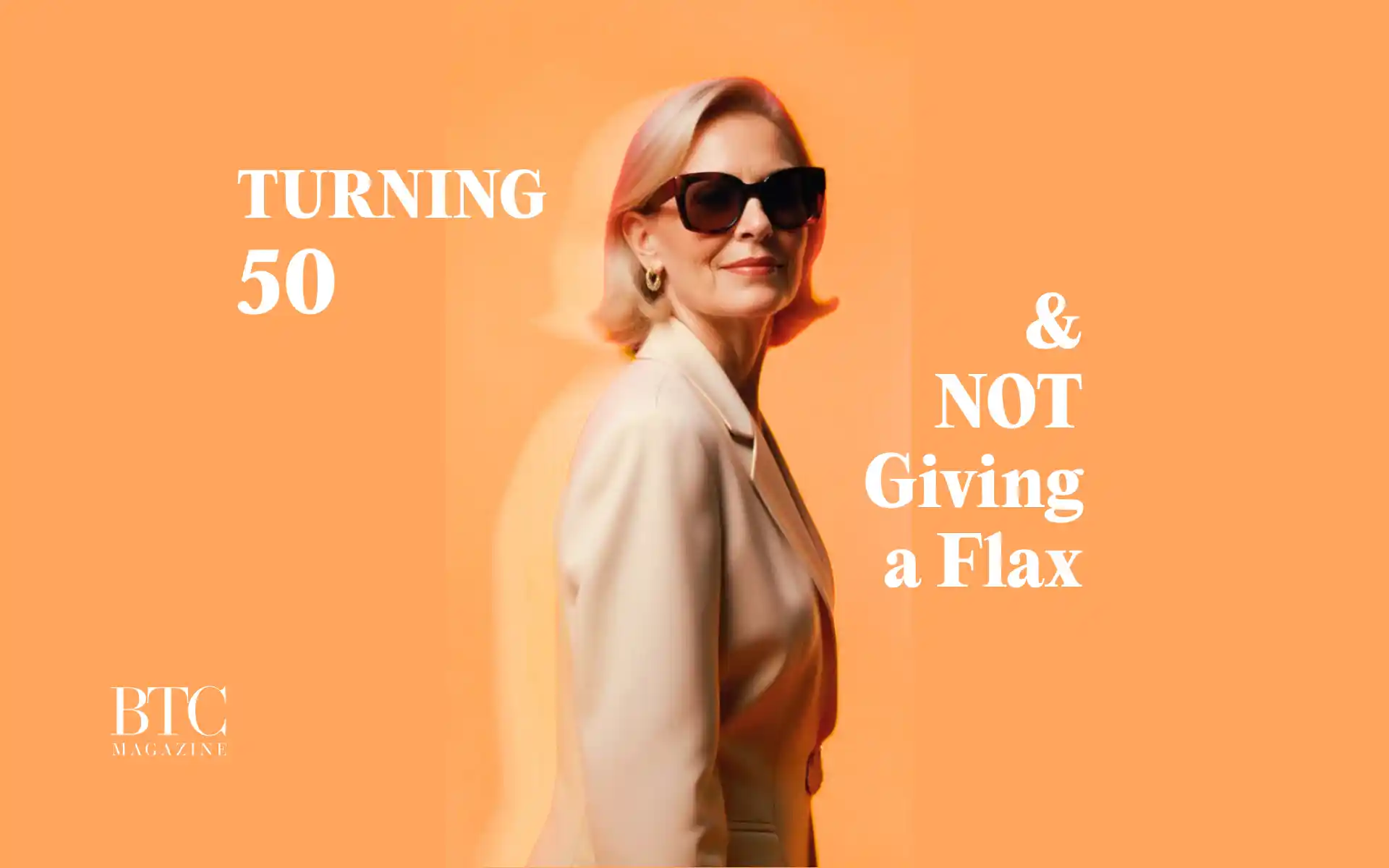 Woman in 50s laughing raising glass birthday