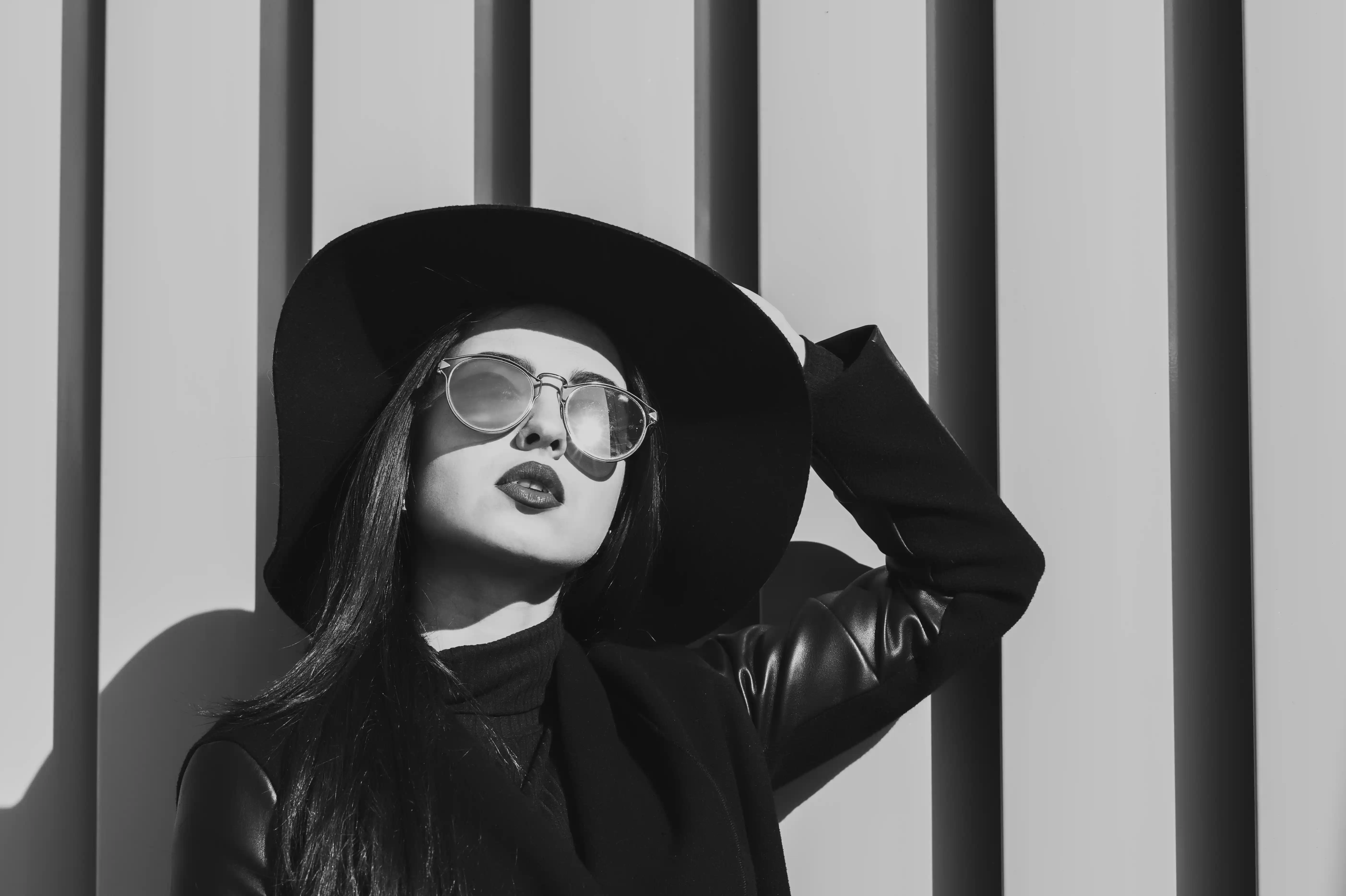 Open book with fanned pages illuminated by dramatic beam of light on dark background, books and literature reading culture women writers and literary lifestyle