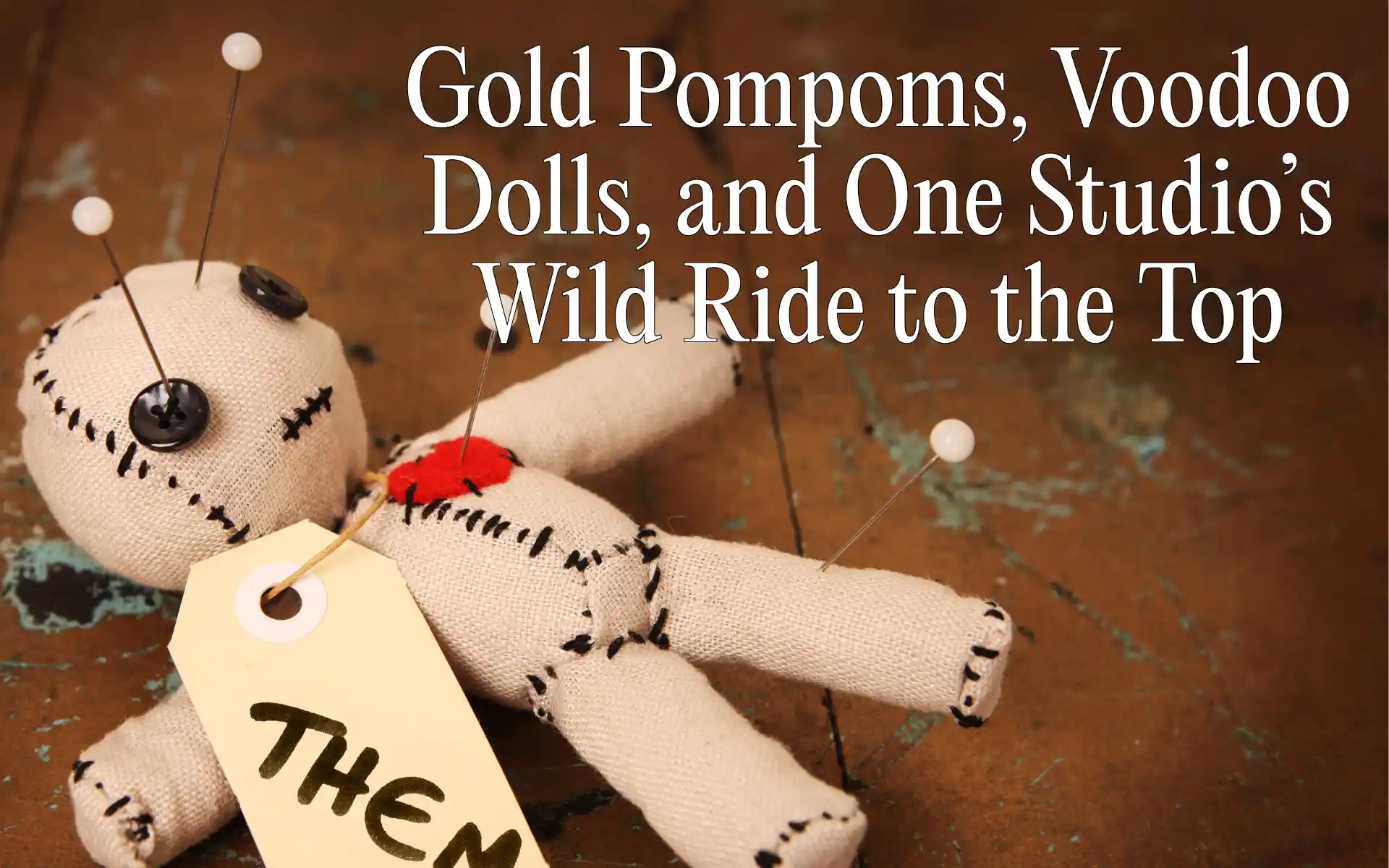 Young dancer mid-leap colorful studio pompoms